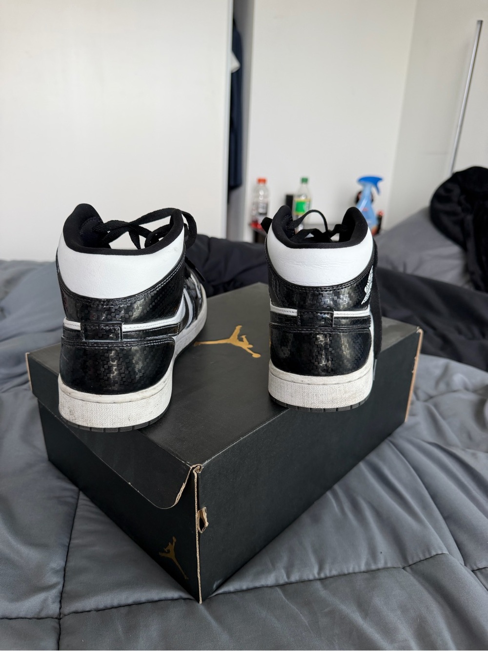 Jordan Black and White Mid-Top Sneakers with Gloss Detail